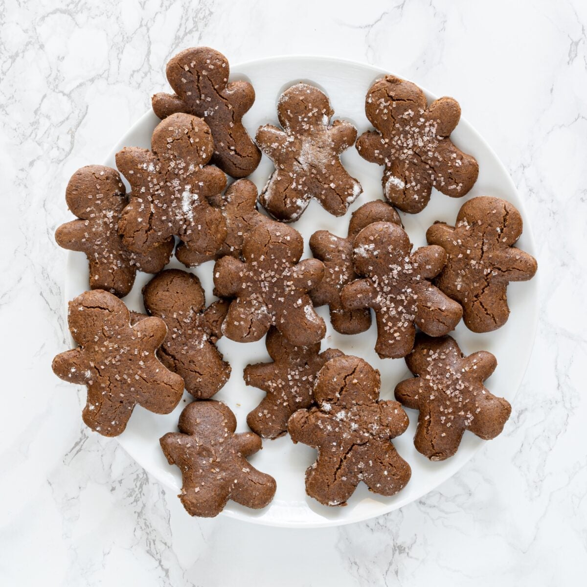 A plate of gingerbread men cookies.