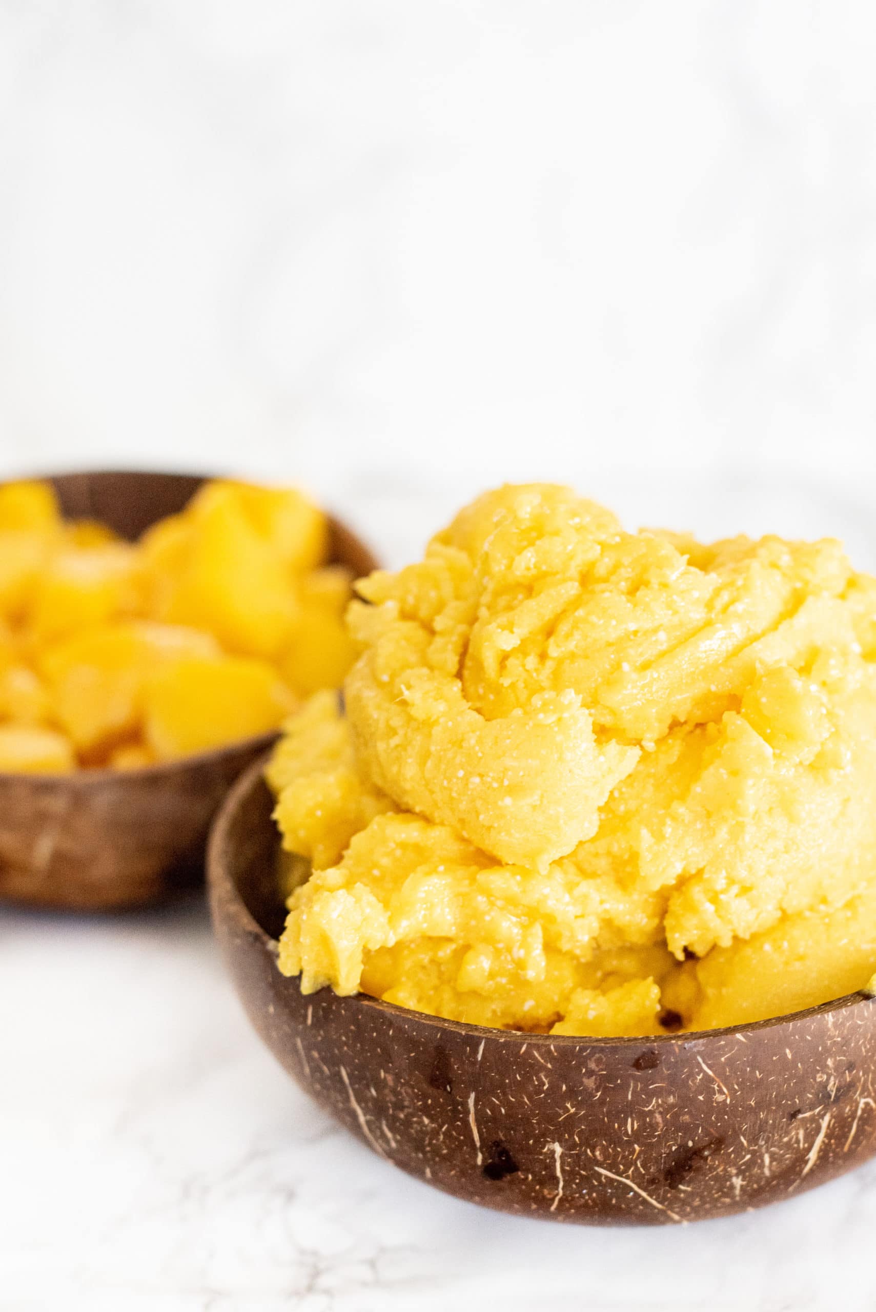 Two bowls of mango ice cream.