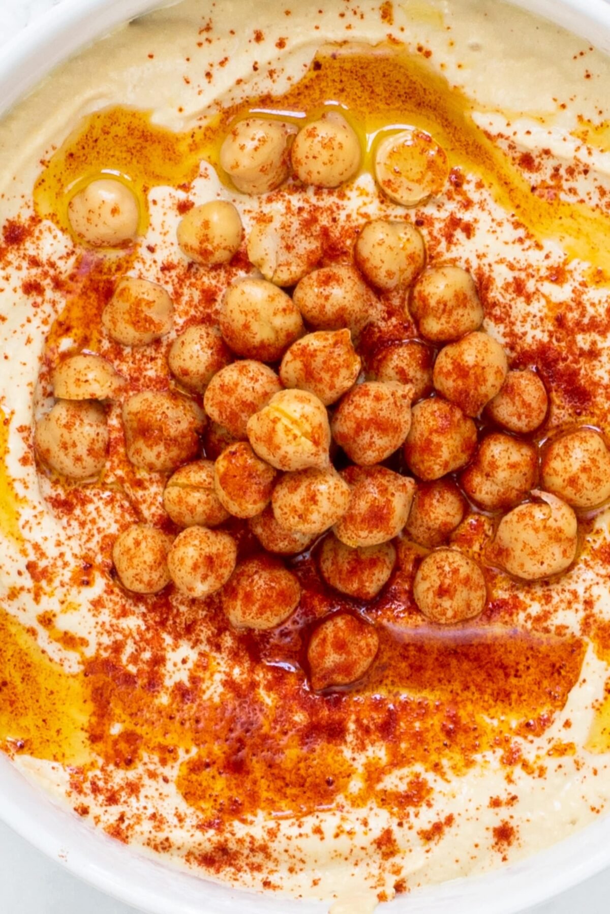 A close up of the vegan hummus in a white bowl.