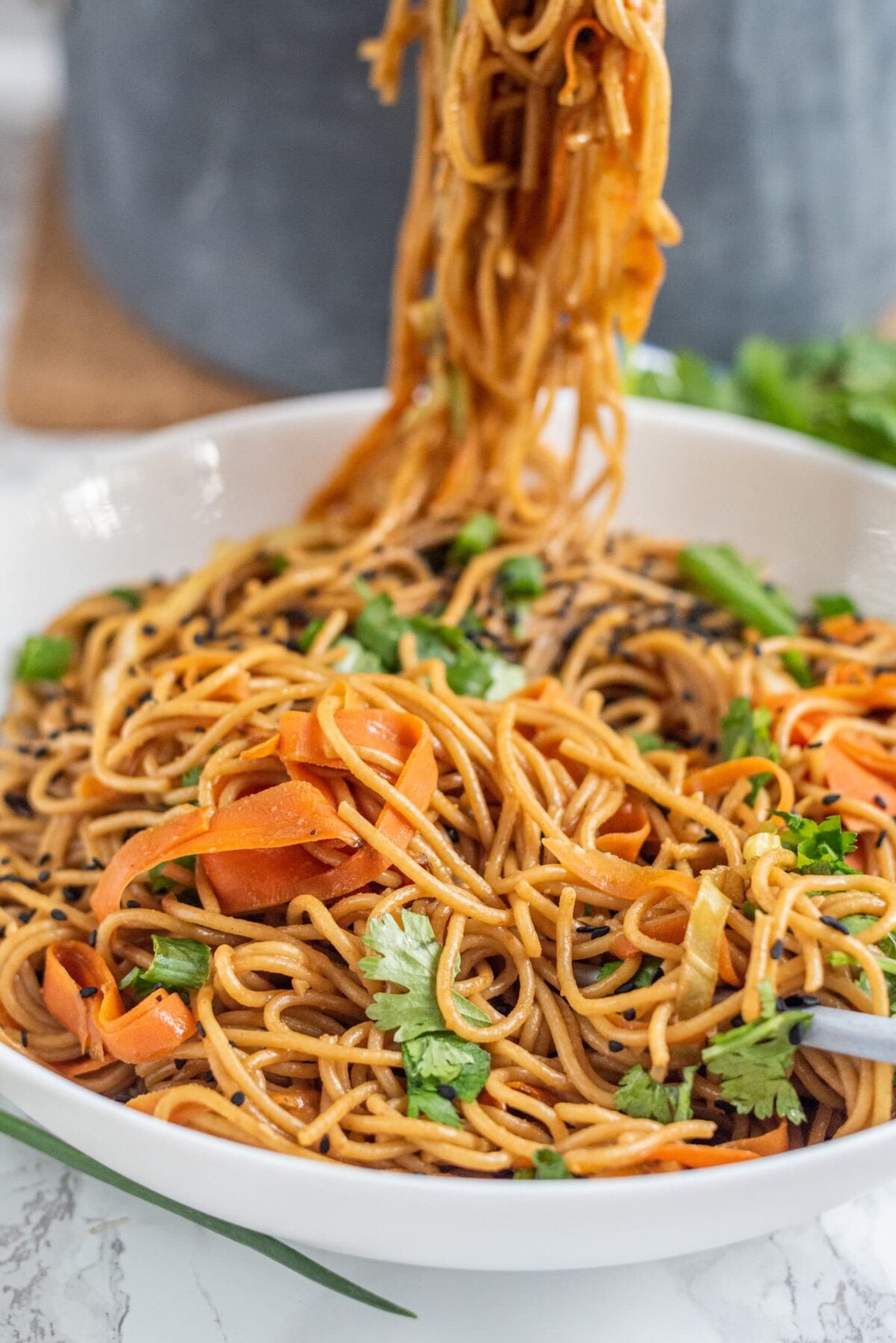 A white bowl filled with vegan pad thai.