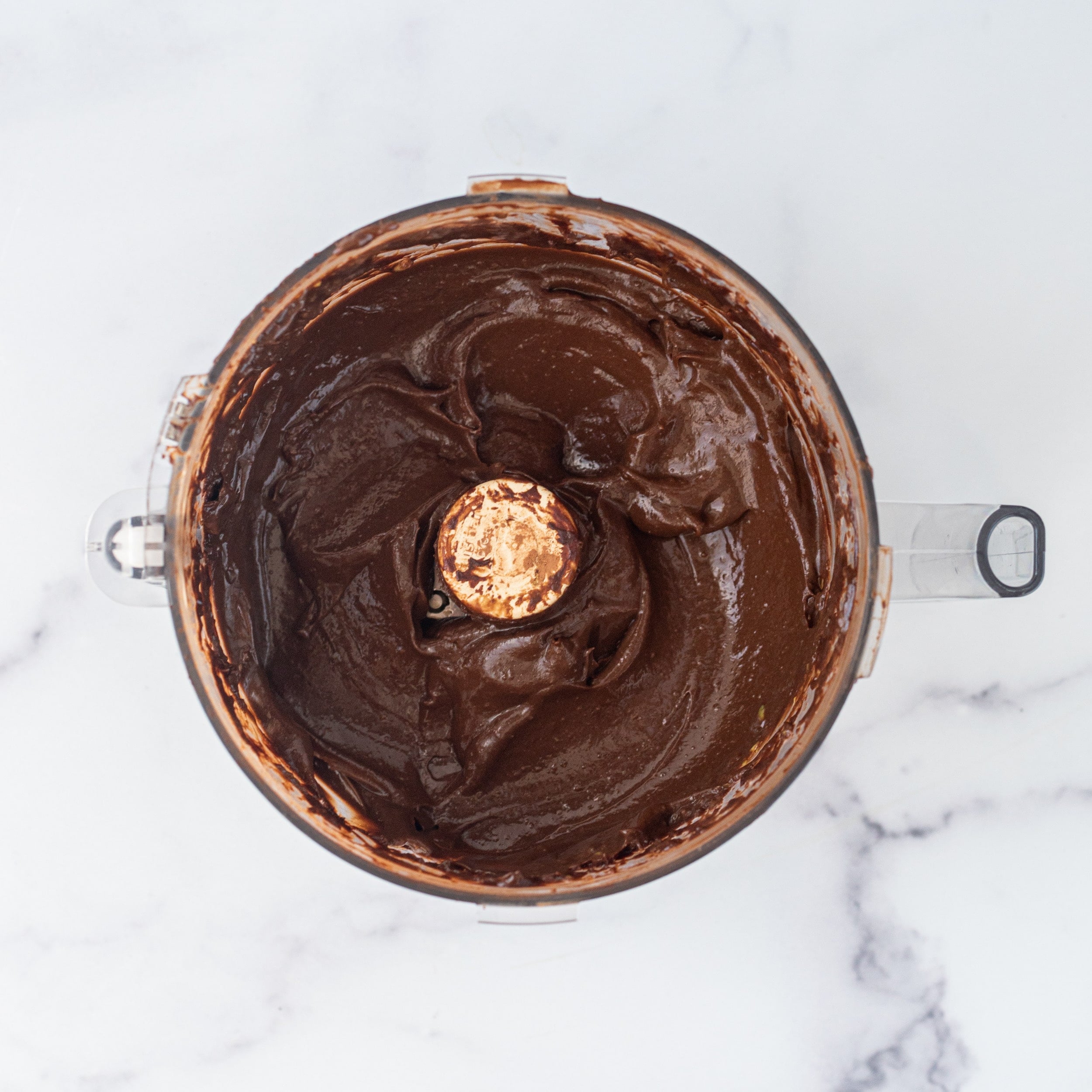 A food processor filled with chocolate pudding.