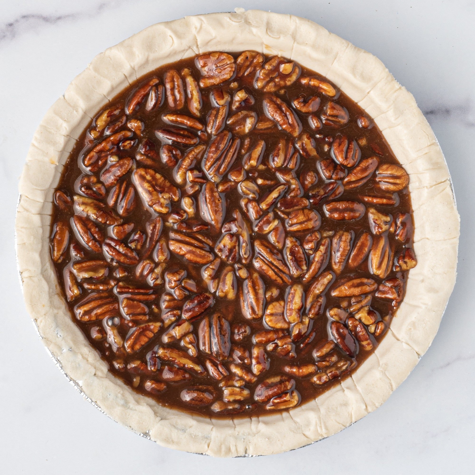 An unbaked pecan pie.