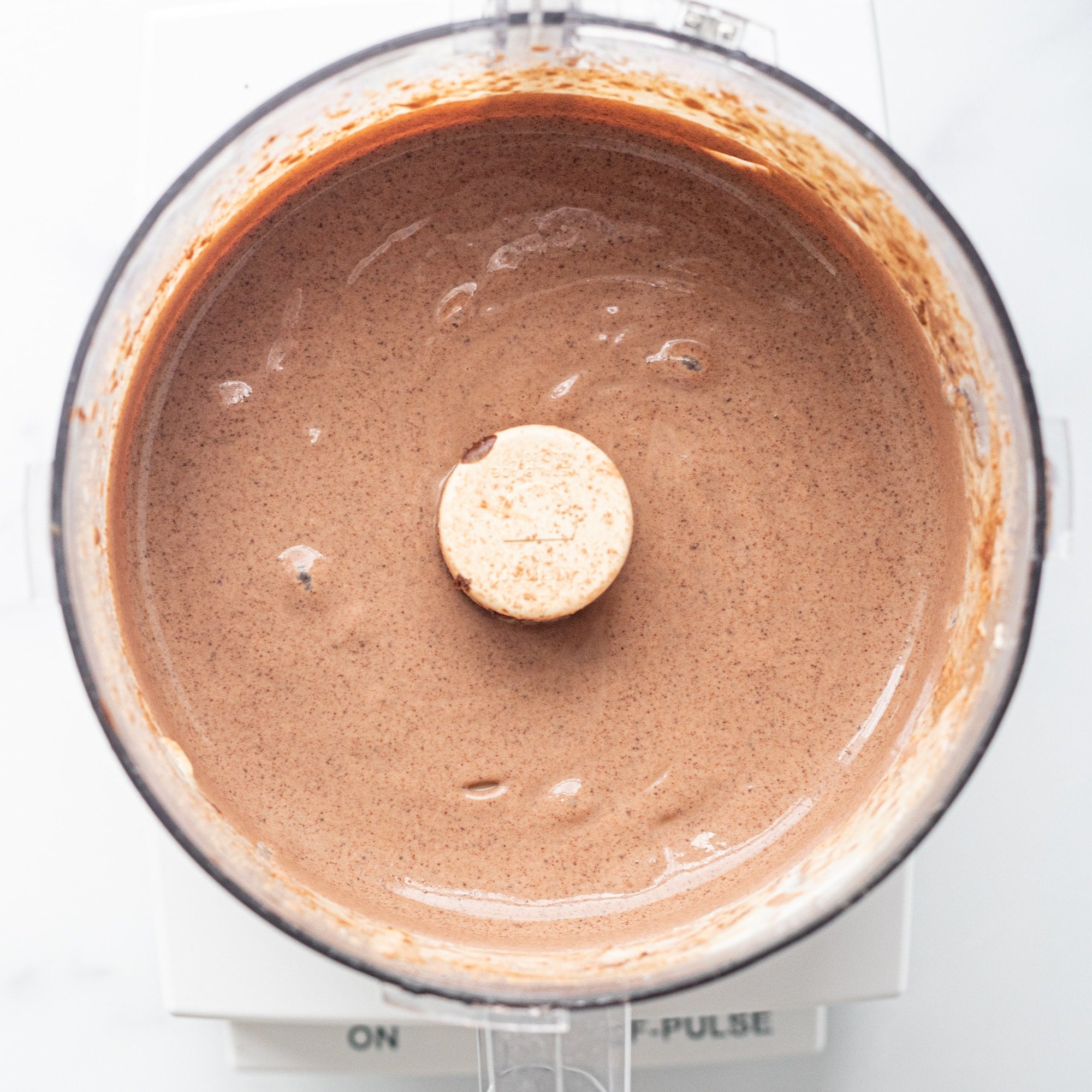 A food processor filled with chocolate mousse.