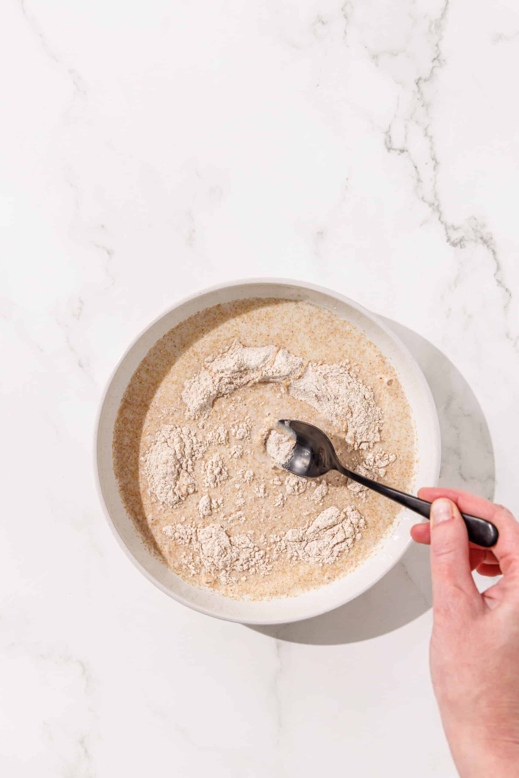 A bowl of flour and breadcrumbs.